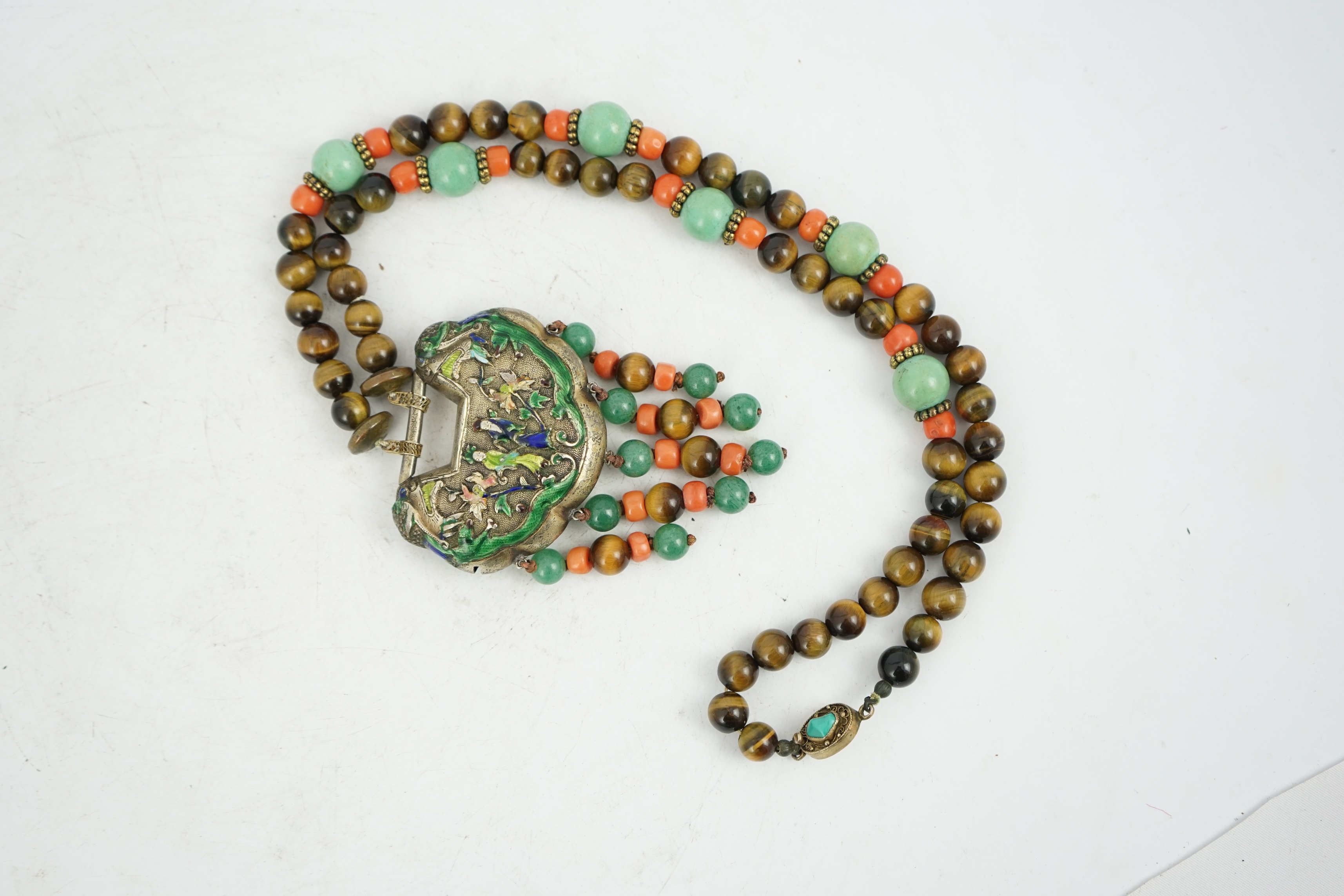 A Chinese silver and enamel amulet tiger's eye, coral and turquoise bead necklace, housed in a liberty box. Condition - good